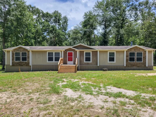 a house view with a garden space