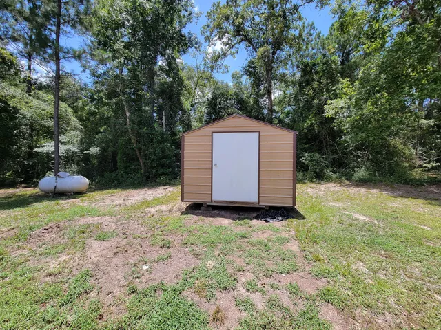 a backyard of a house with lots of green space