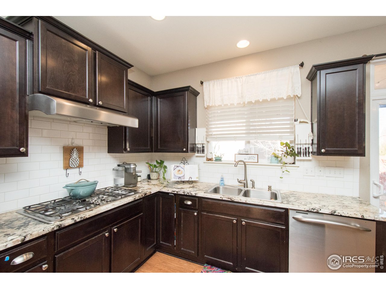 909 Trading Post Road Fort Collins, CO 80524 - Photo 8 of 30 Kitchen with Granite Counter Tops
