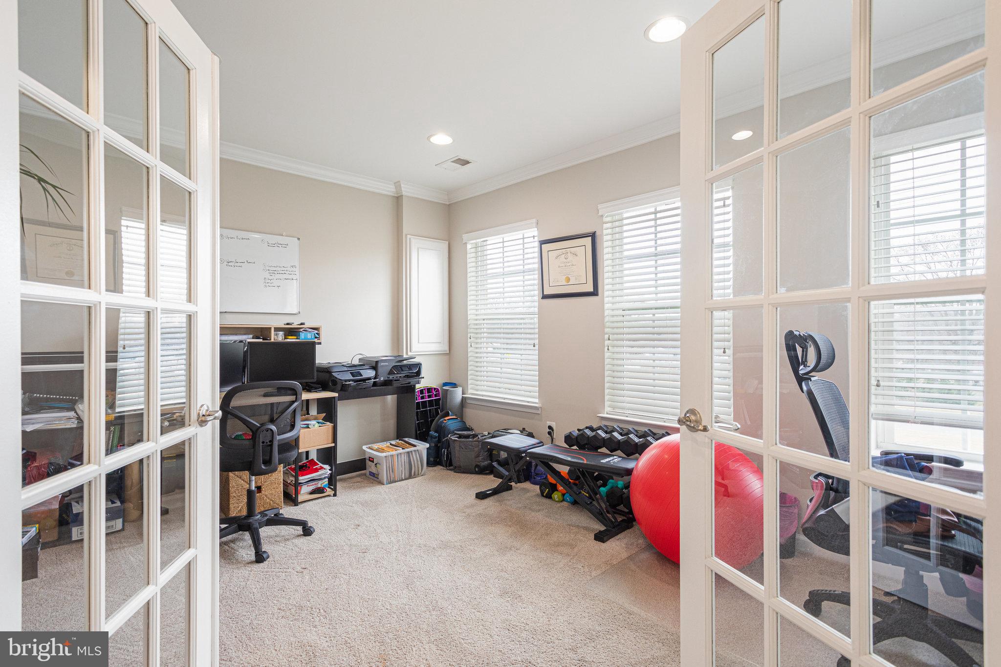 705 Addison Road South Capitol Heights, MD 20743 - Photo 4 of 26 French doors open to a large, bright office.