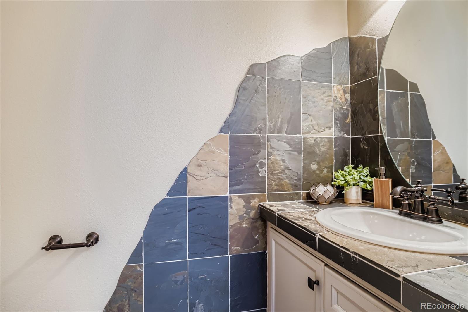 13342 Douglass Ranch Drive Pine, CO 80470 - Photo 13 of 31 a bathroom with a sink and a mirror