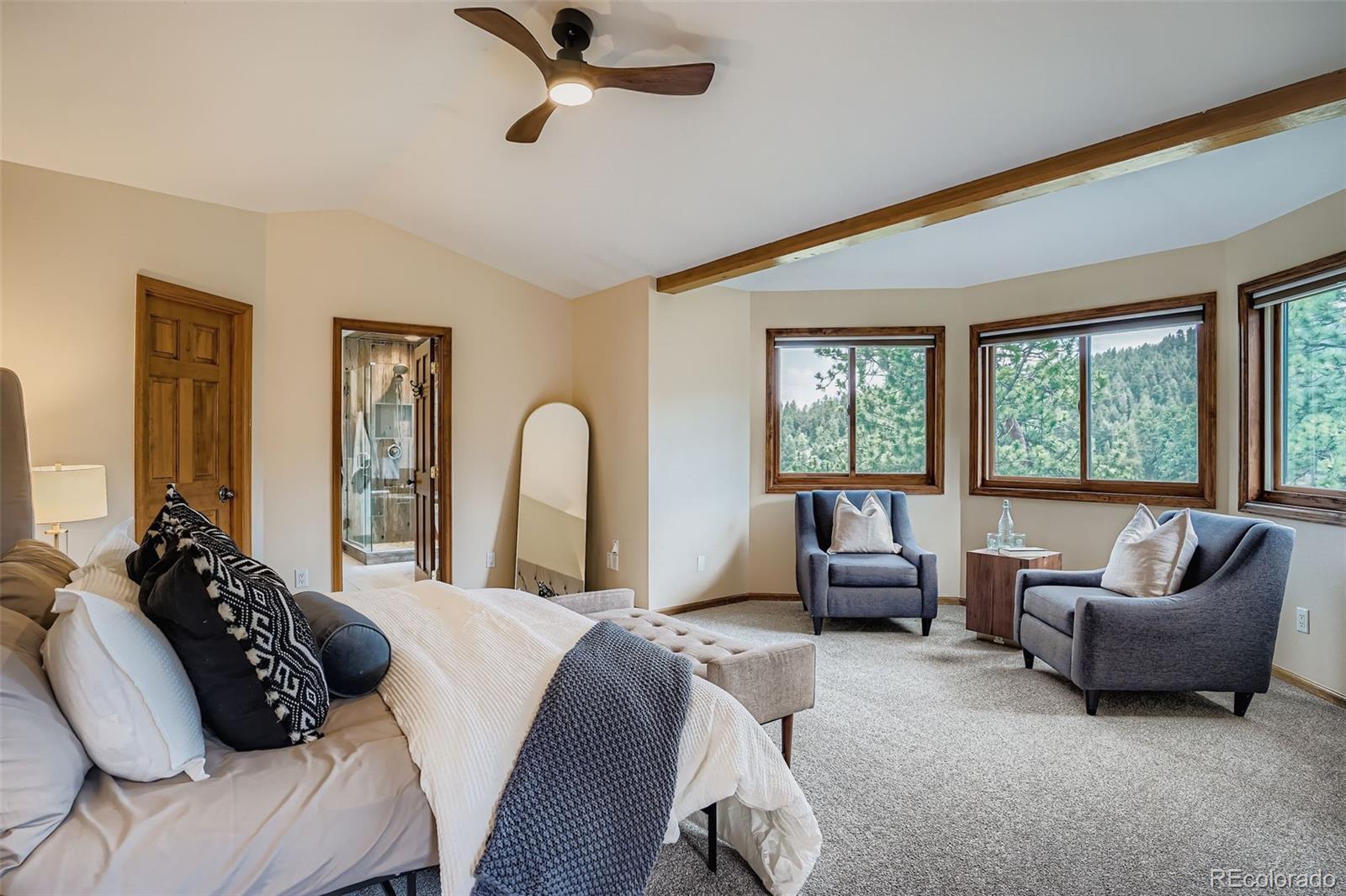 13342 Douglass Ranch Drive Pine, CO 80470 - Photo 14 of 31 a bedroom with a bed and a couch