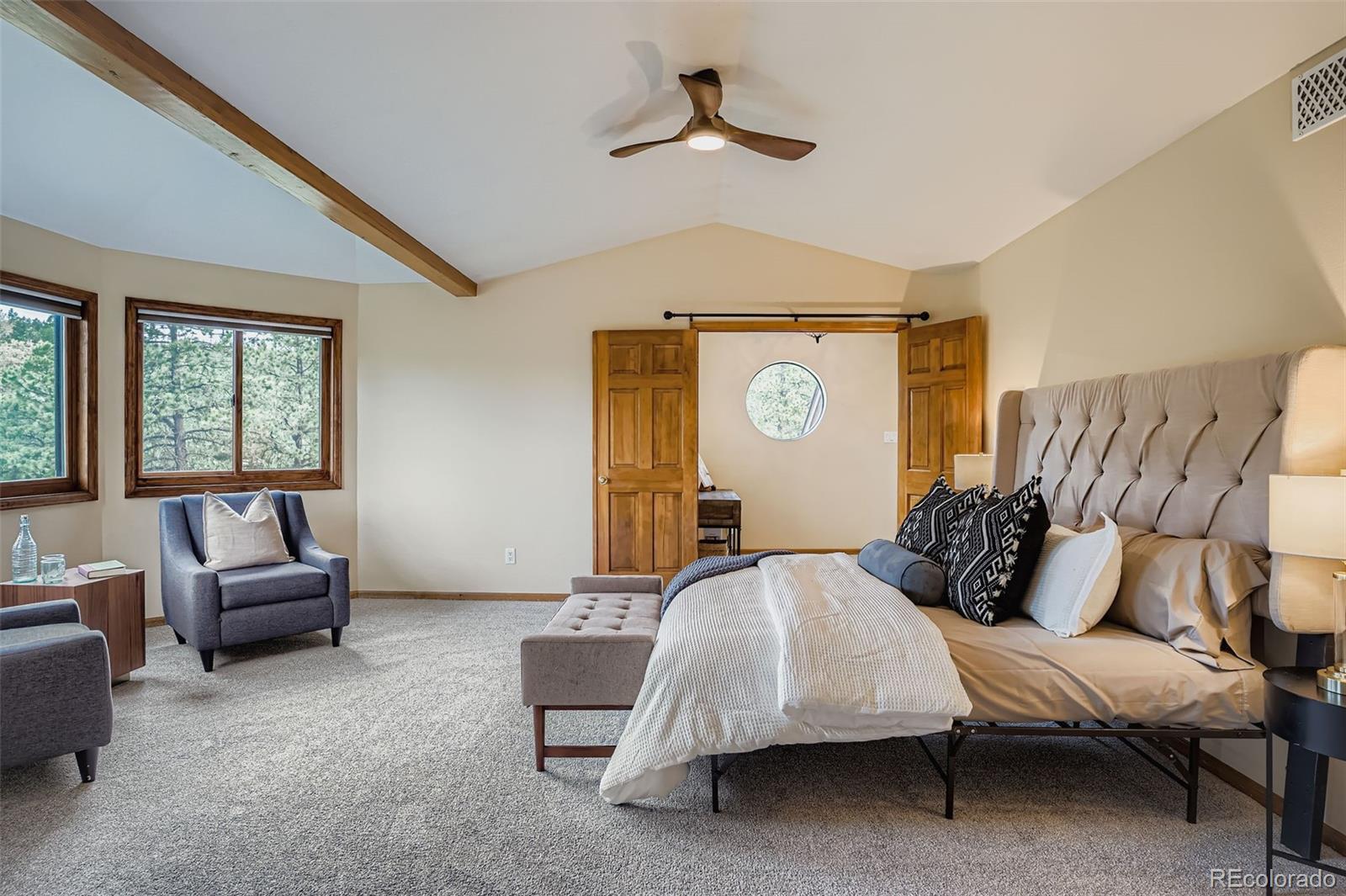 13342 Douglass Ranch Drive Pine, CO 80470 - Photo 15 of 31 a bedroom with bed and window