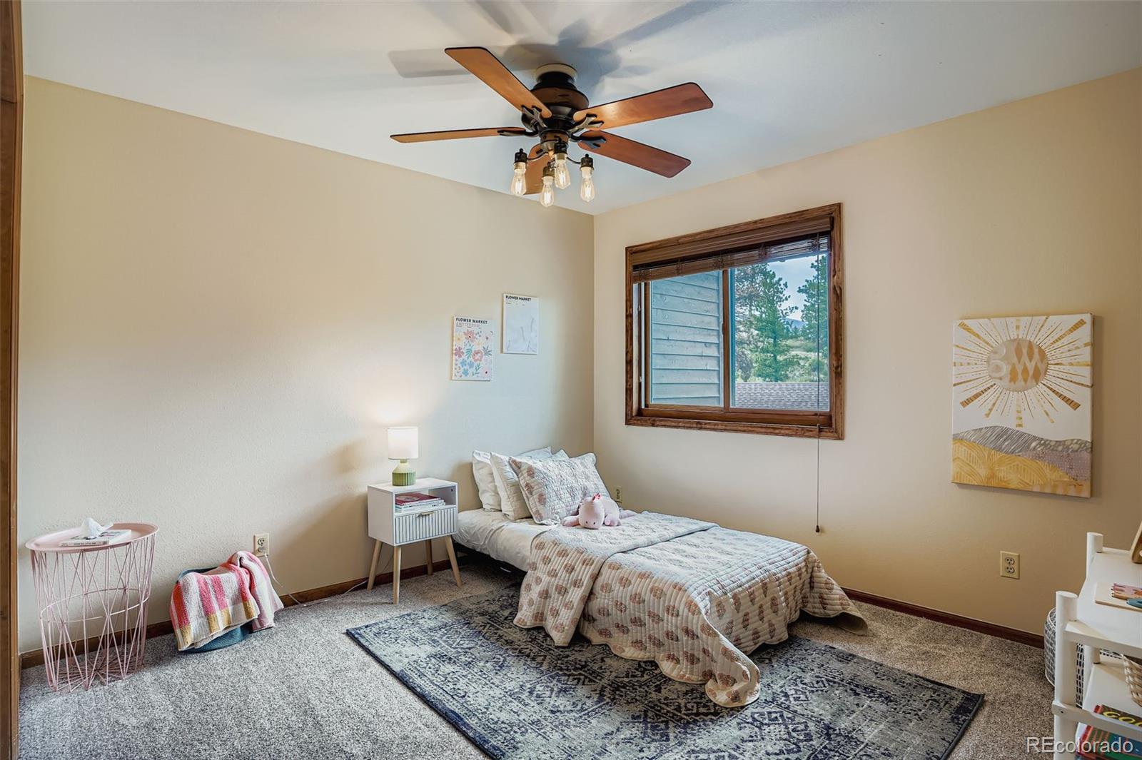 13342 Douglass Ranch Drive Pine, CO 80470 - Photo 18 of 31 a bedroom with a bed and window
