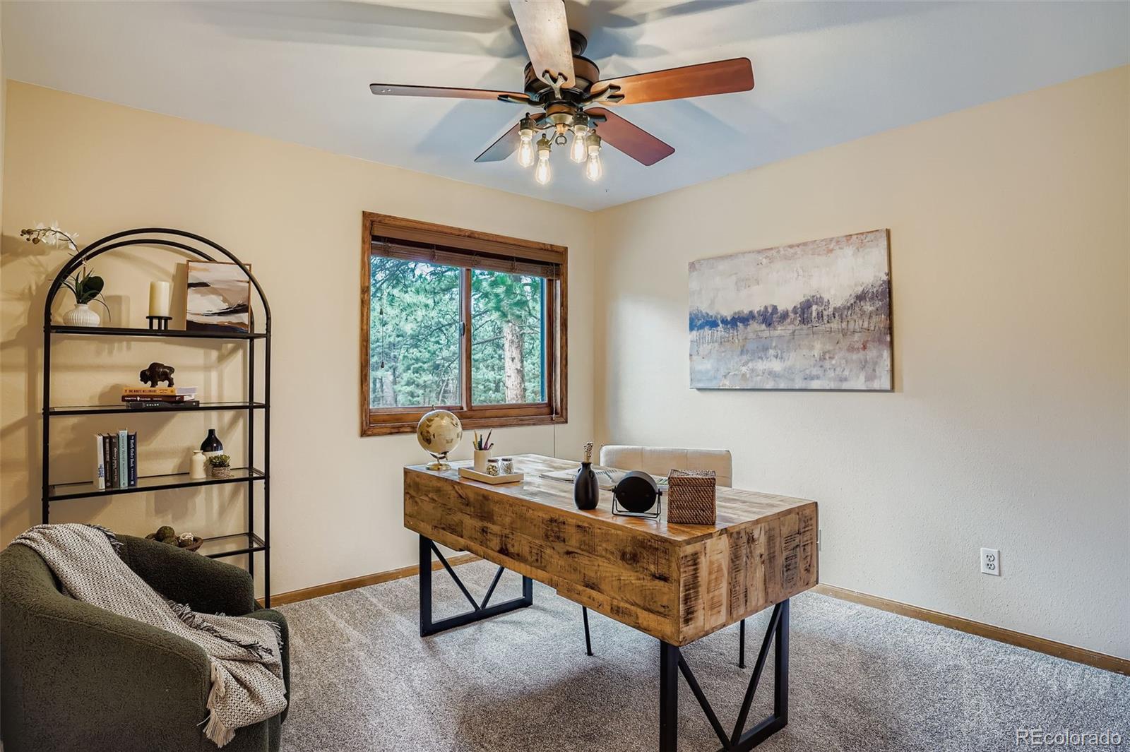13342 Douglass Ranch Drive Pine, CO 80470 - Photo 19 of 31 a living room with furniture a window and a chandelier