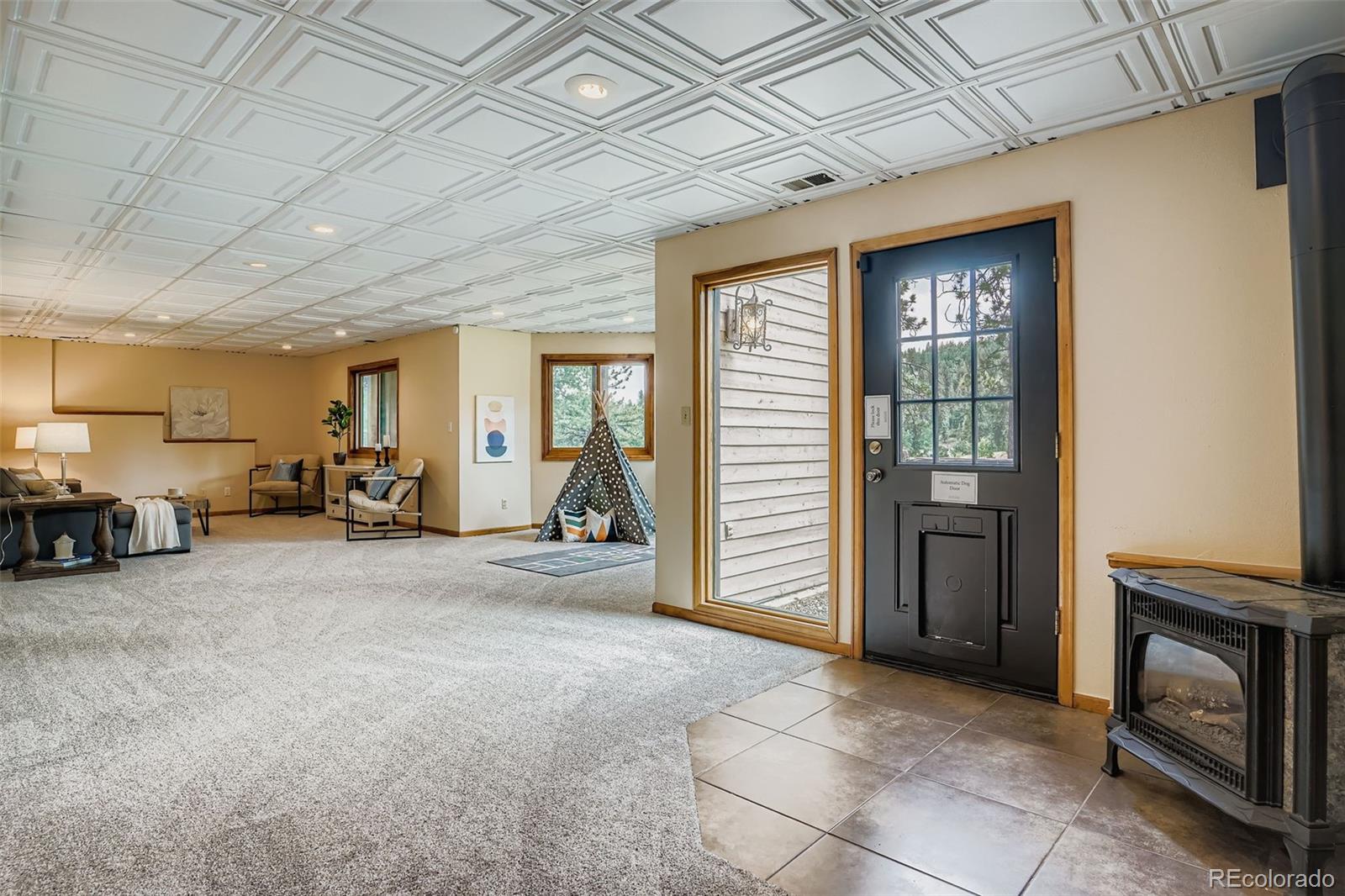 13342 Douglass Ranch Drive Pine, CO 80470 - Photo 22 of 31 a view of a livingroom with furniture and a fireplace