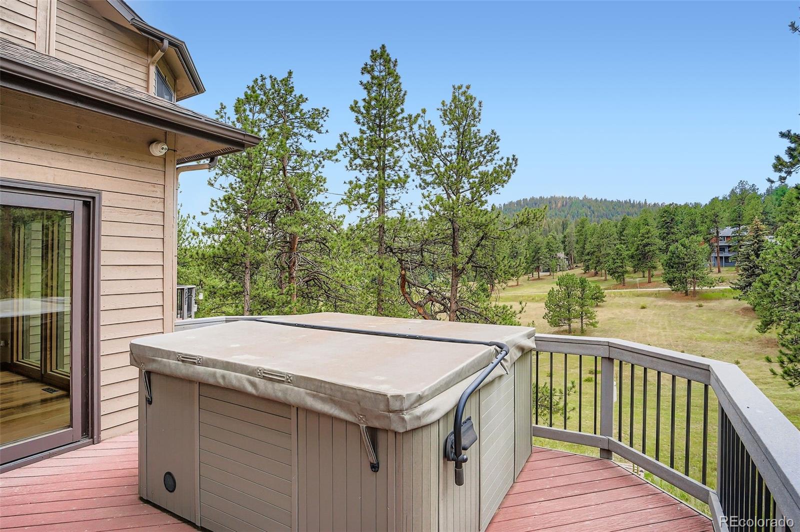 13342 Douglass Ranch Drive Pine, CO 80470 - Photo 26 of 31 a view of a balcony with yard