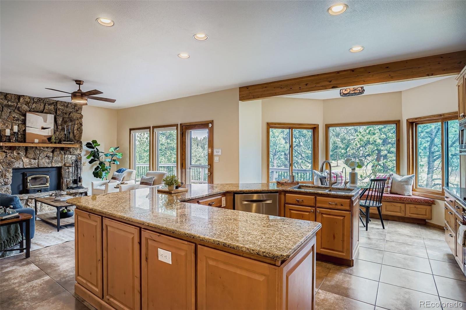 13342 Douglass Ranch Drive Pine, CO 80470 - Photo 9 of 31 a kitchen with sink stove and living room