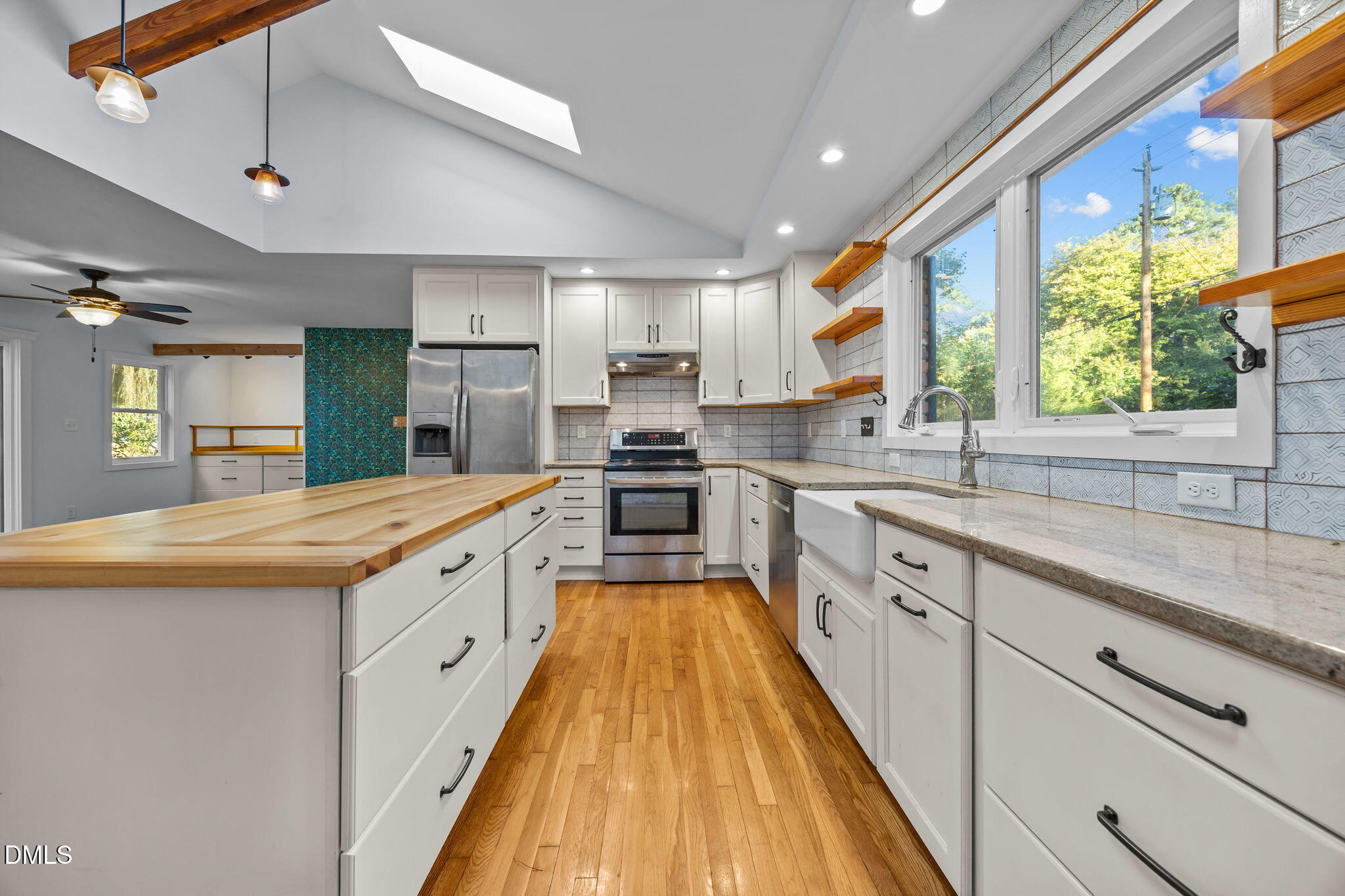 2231 Rumson Road Raleigh, NC 27610 - Photo 1 of 45 a large kitchen with stainless steel appliances granite countertop a large window and a sink