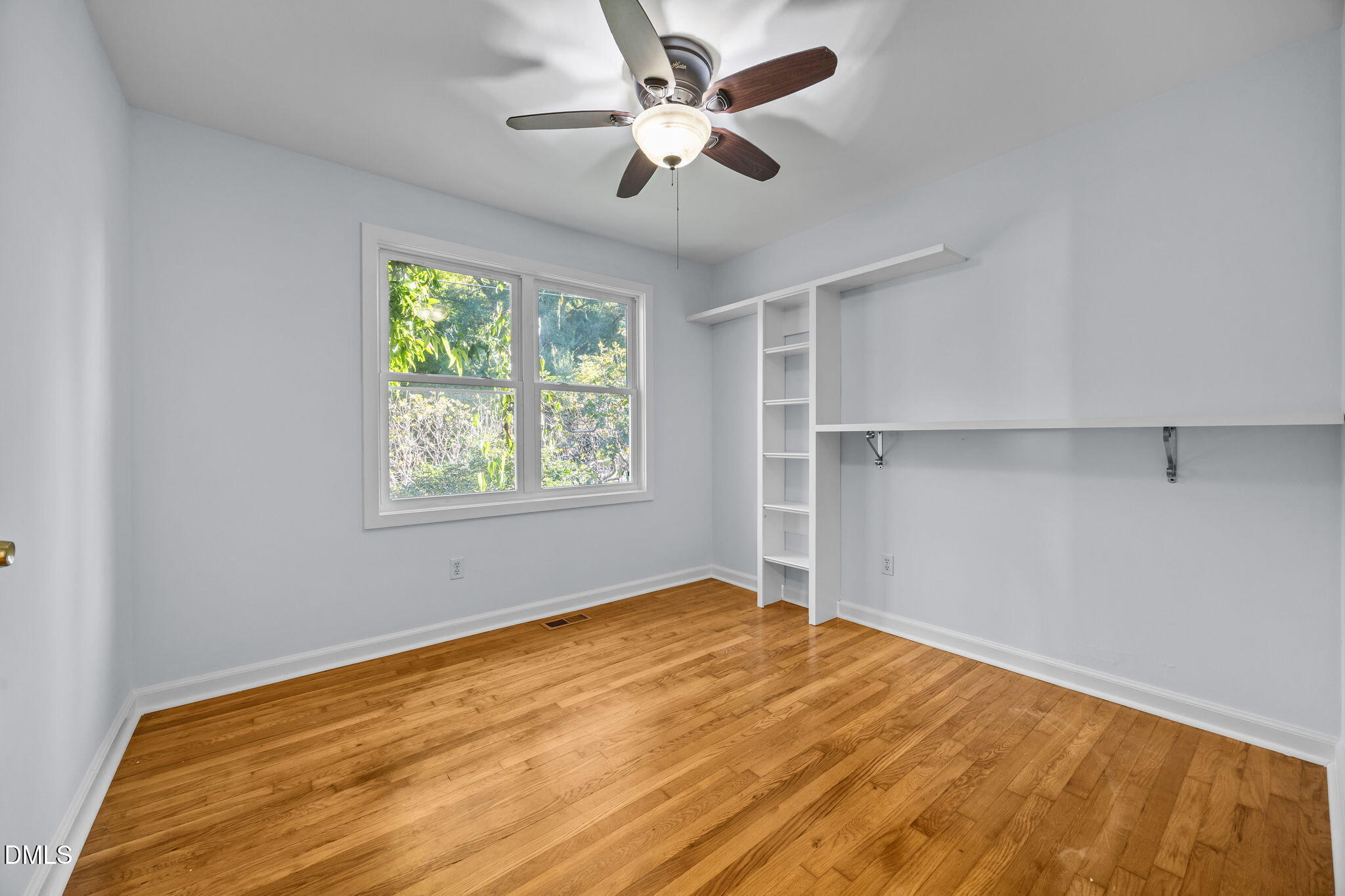 2231 Rumson Road Raleigh, NC 27610 - Photo 24 of 45 a view of empty room with window and ceiling fan
