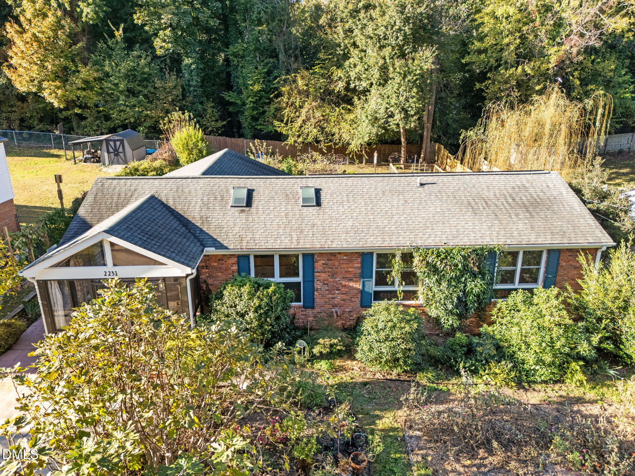 2231 Rumson Road Raleigh, NC 27610 - Photo 4 of 45 aerial view of a house with a yard and potted plants