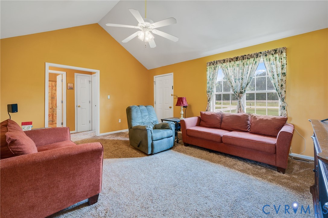 5280 West Quaker Road Disputanta, VA 23875 - Photo 20 of 33 a living room with furniture and a large window