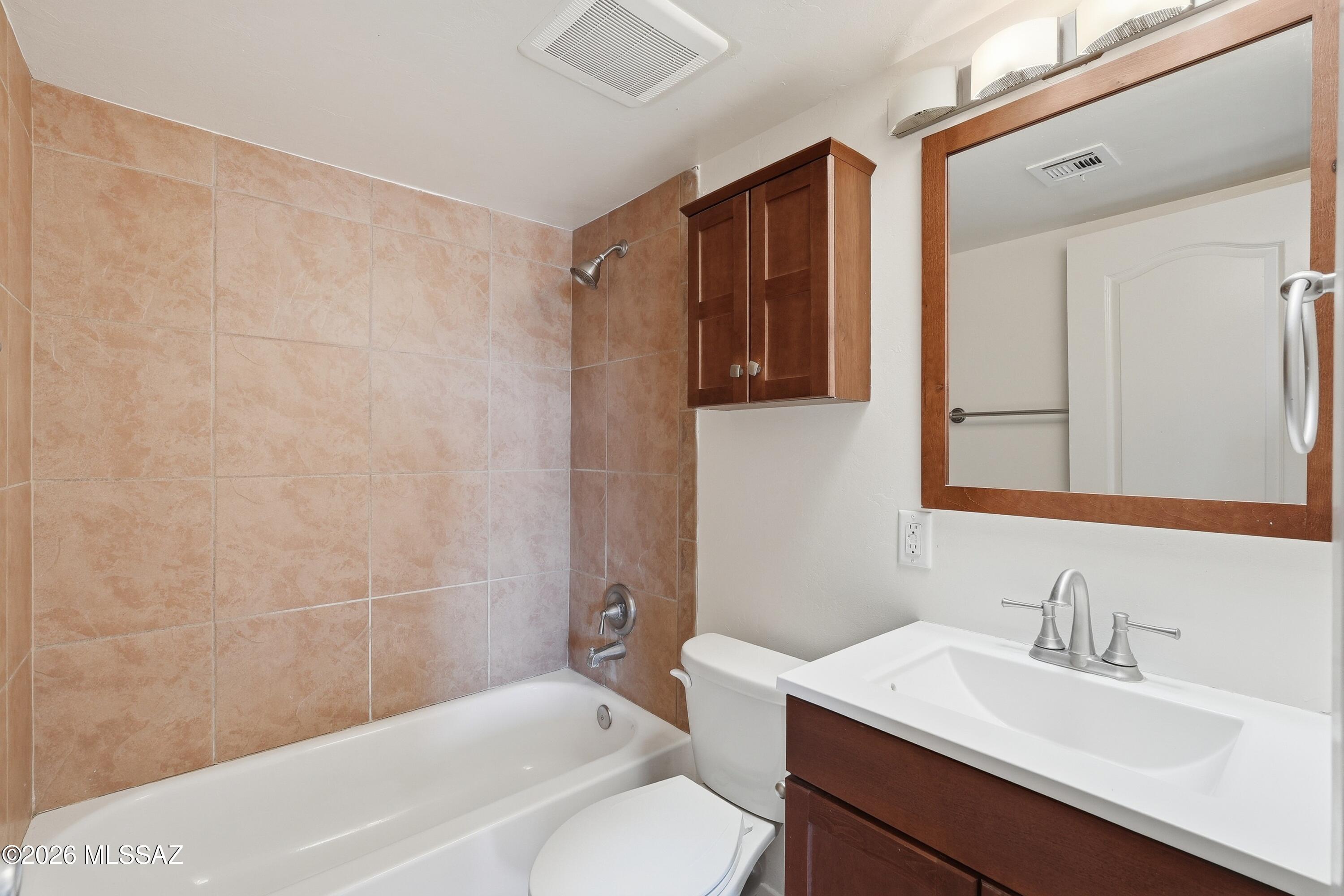 1808 West Caravelle Road Tucson, AZ 85713 - Photo 21 of 38 a bathroom with a sink a toilet and shower
