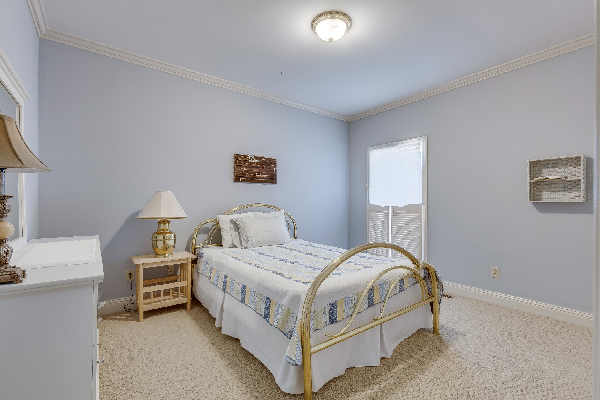 1111 Temple Ridge Court Nashville, TN 37221 - Photo 35 of 46 a bedroom with a bed and a lamp