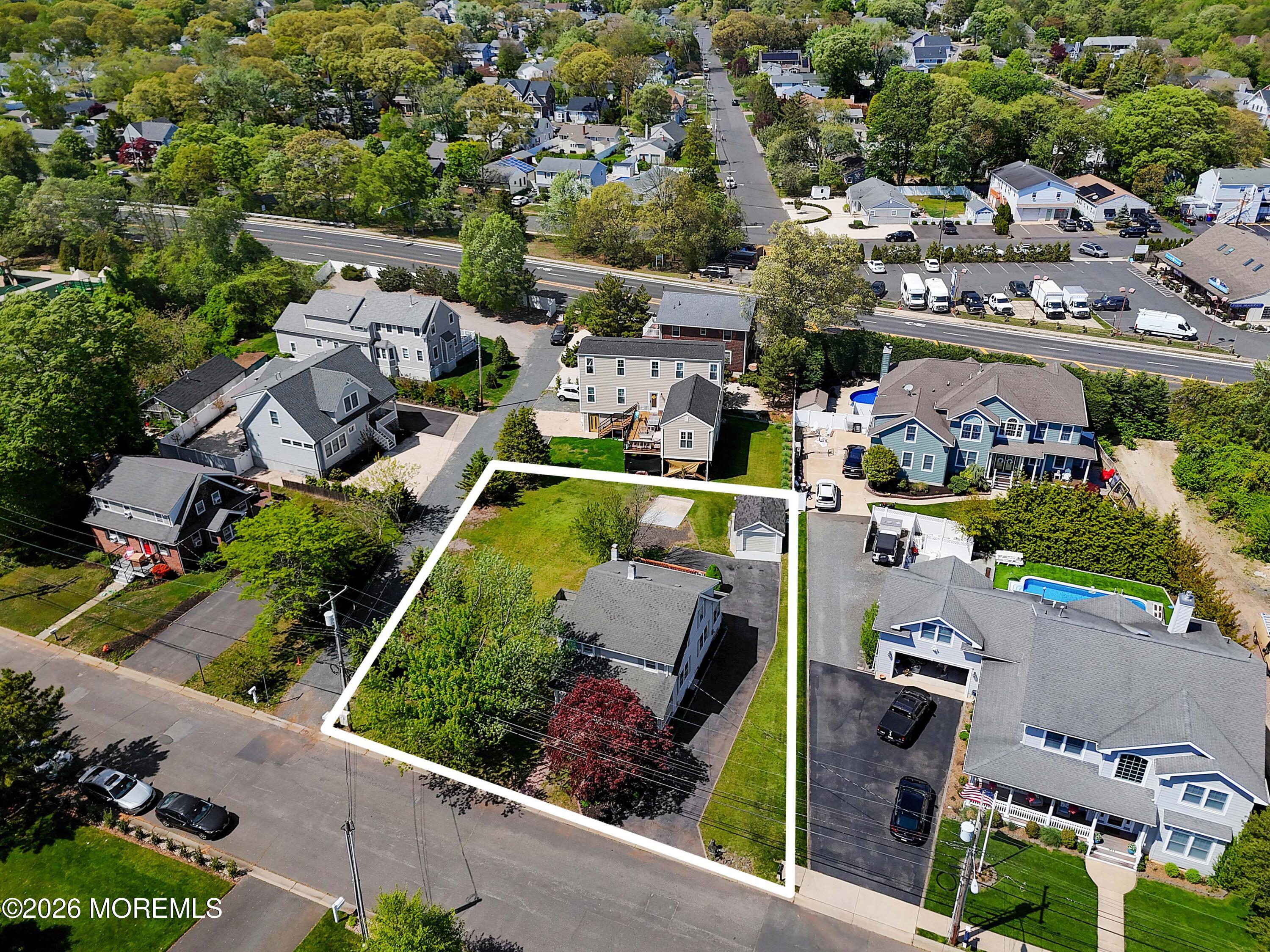 715 Howe Street Point Pleasant, NJ 08742 - Photo 40 of 45 an aerial view of a house with a garden and lake view