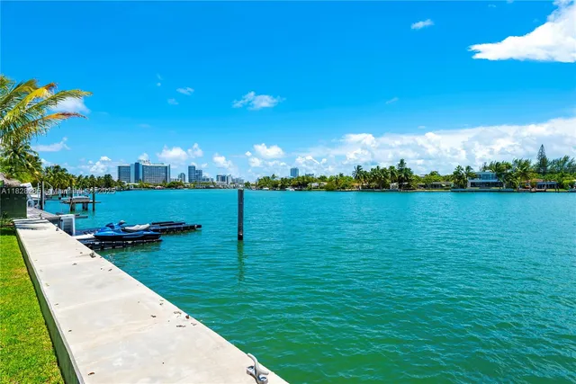 a view of a golf course with an ocean