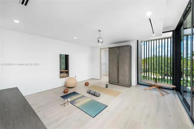 a bedroom with furniture and wooden floor