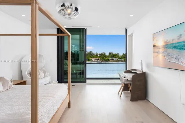 a balcony with furniture and a large window