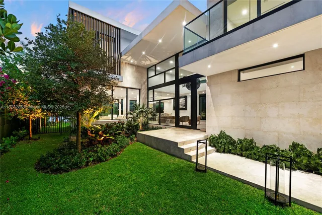 a view of a patio with table and chairs and potted plants