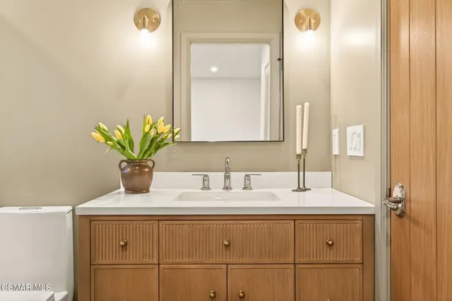 a bathroom with a sink and a mirror