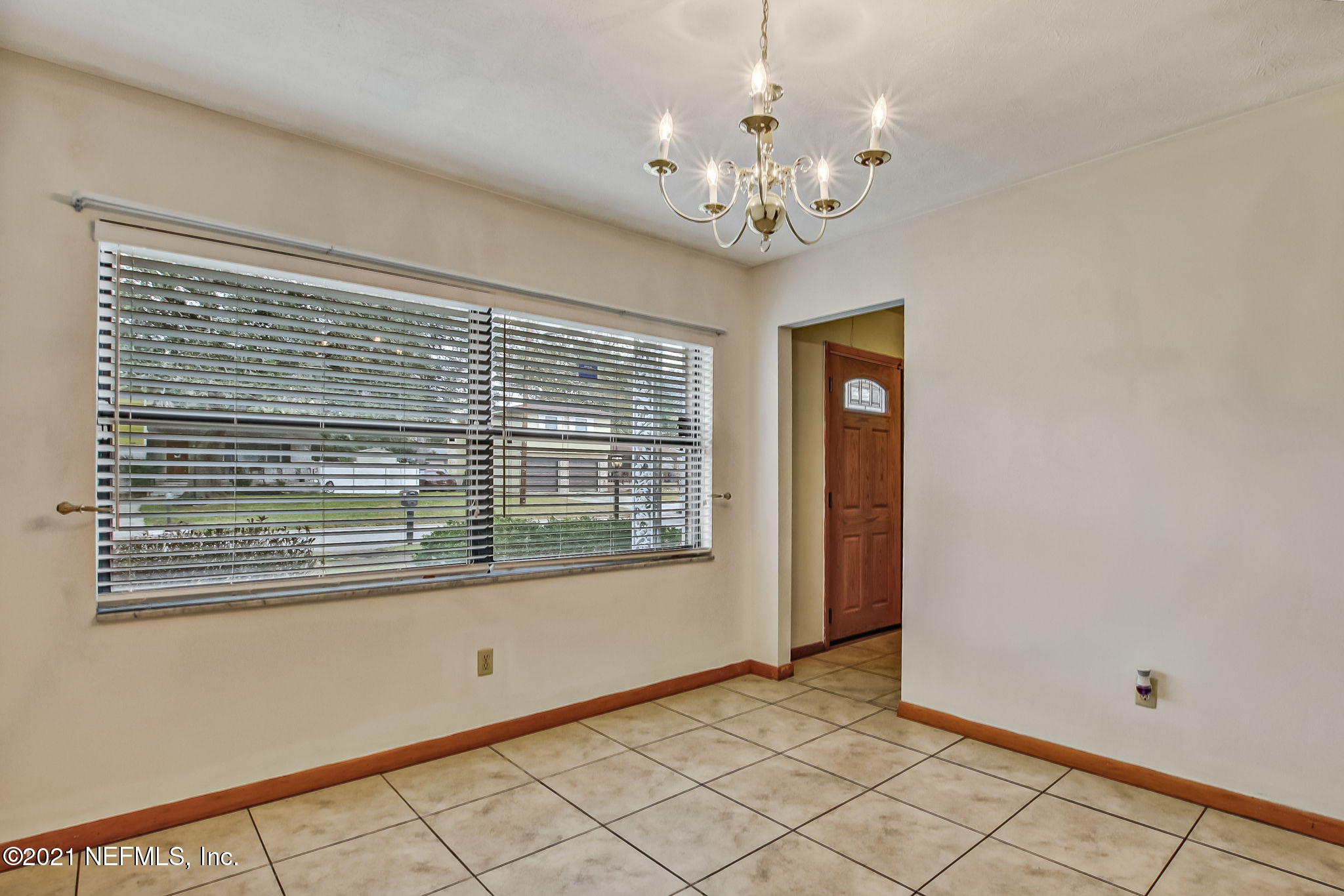8290 Barracuda Road Jacksonville, FL 32244 - Photo 14 of 41 a view of an empty room with a window