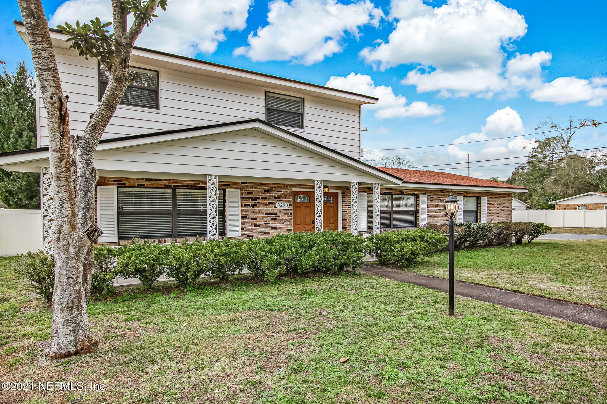 8290 Barracuda Road Jacksonville, FL 32244 - Photo 2 of 41 a view of a house with a yard and a garden