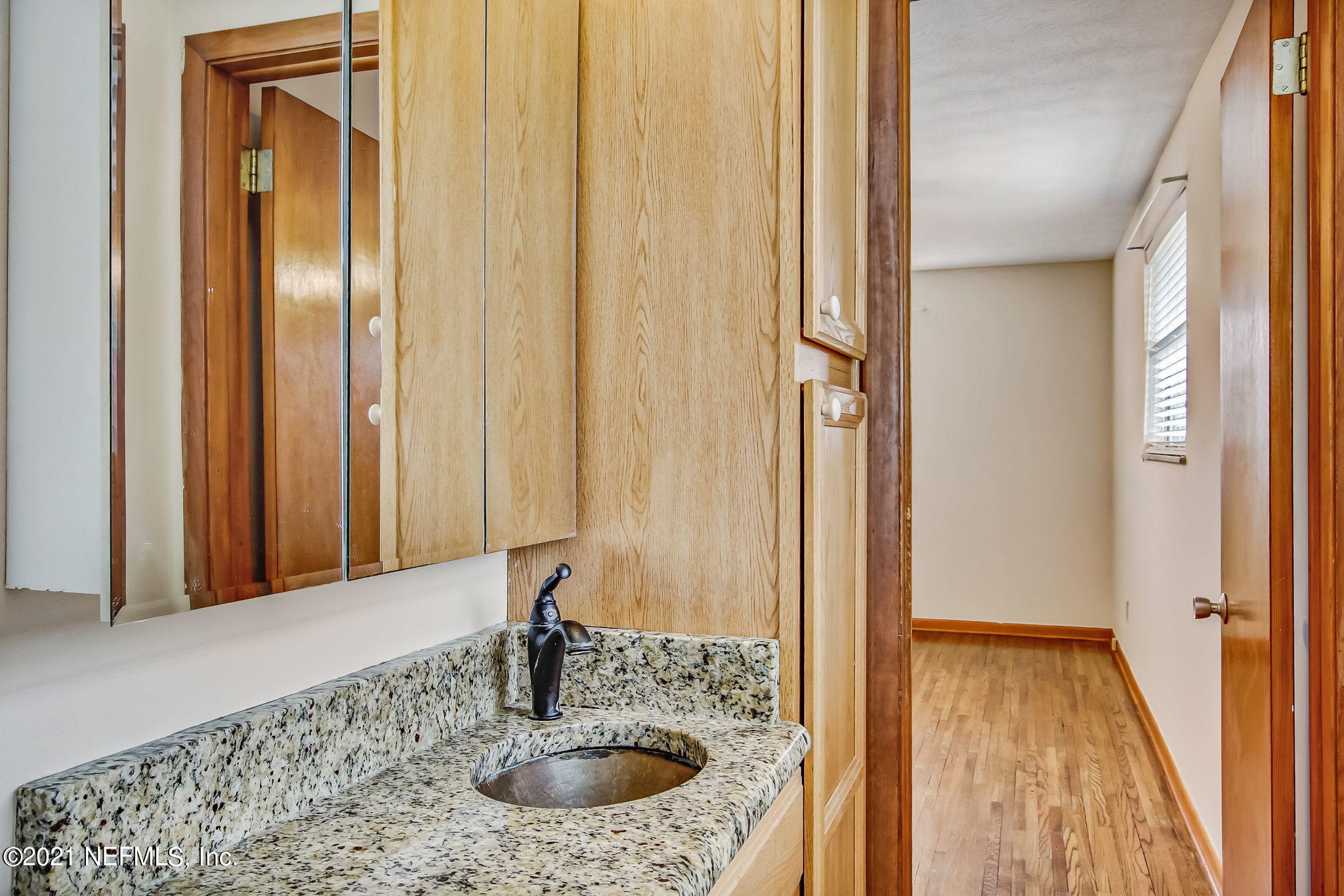 8290 Barracuda Road Jacksonville, FL 32244 - Photo 28 of 41 a bathroom with a sink and a mirror