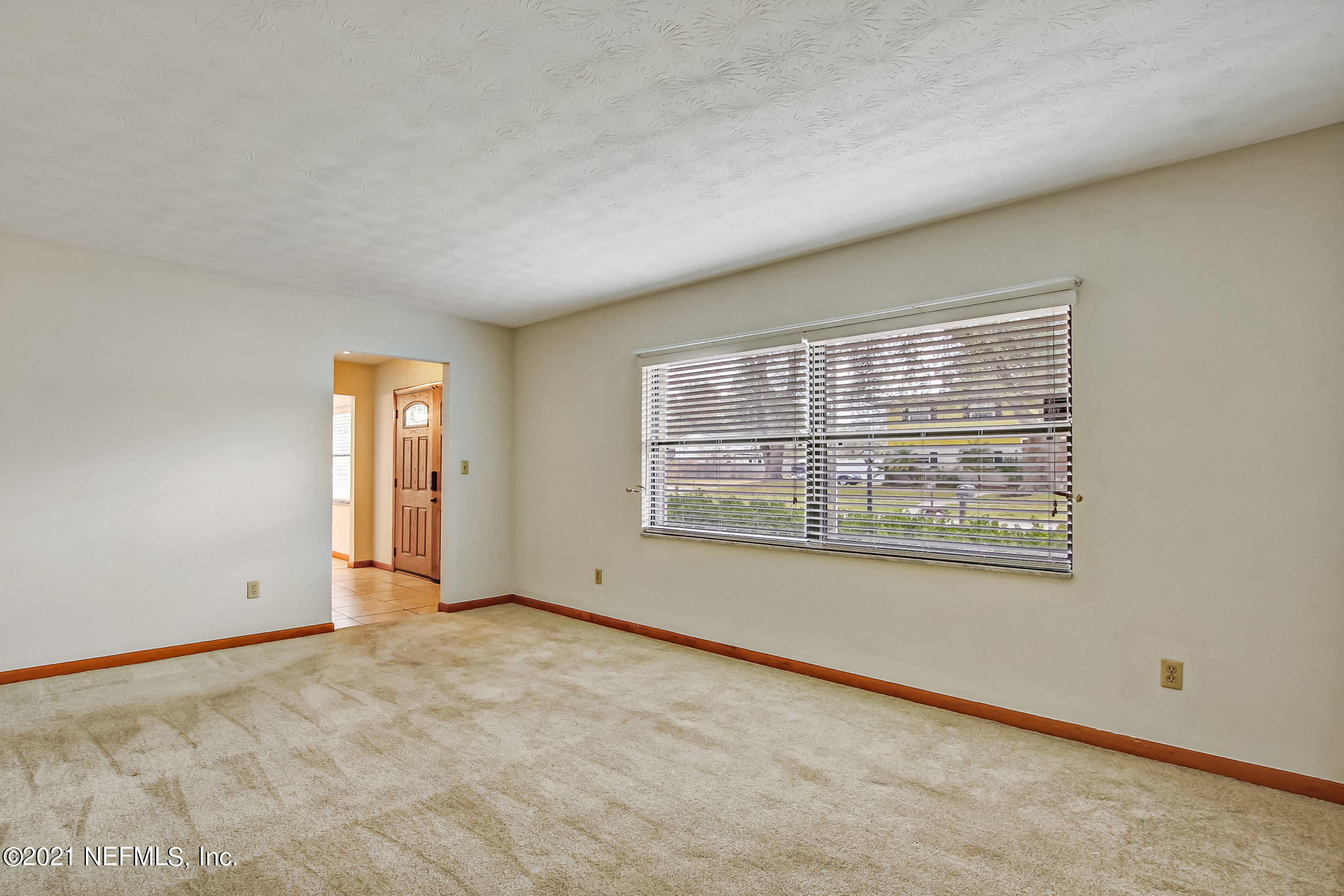 8290 Barracuda Road Jacksonville, FL 32244 - Photo 8 of 41 a view of an empty room with a window