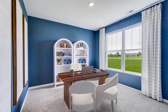 a dining room with furniture and a window