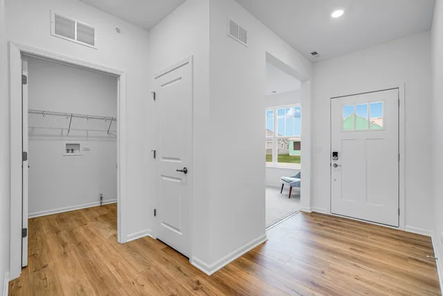 wooden floor in a hall with an empty room