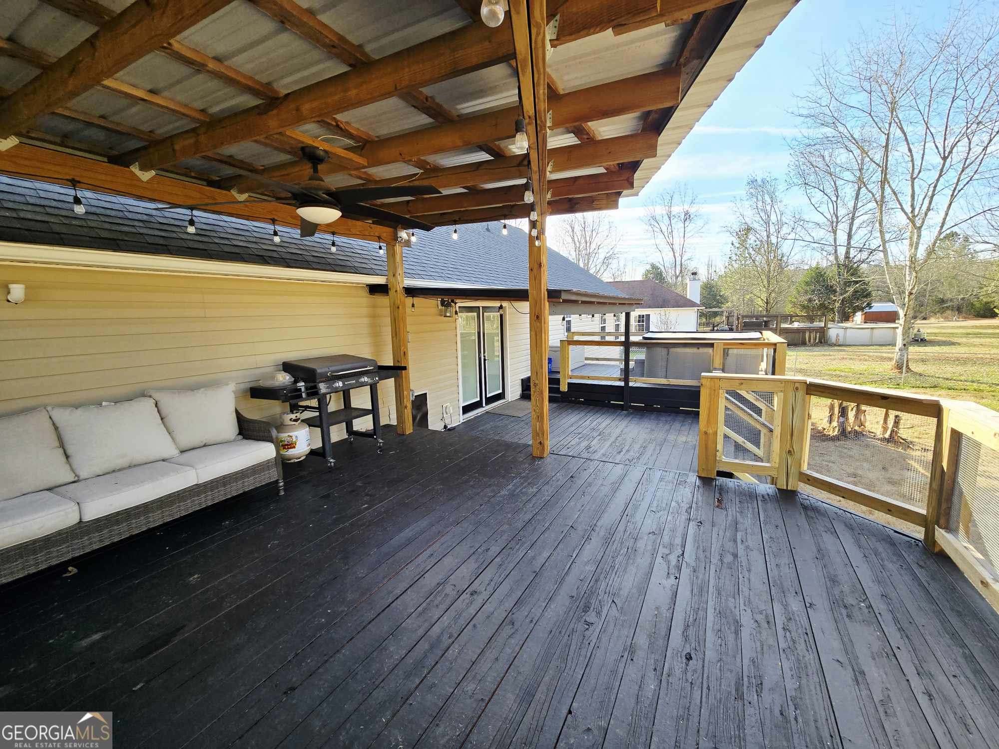 10 Shannons Lane Comer, GA 30629 - Photo 13 of 50 a living room with patio furniture and a wooden floor