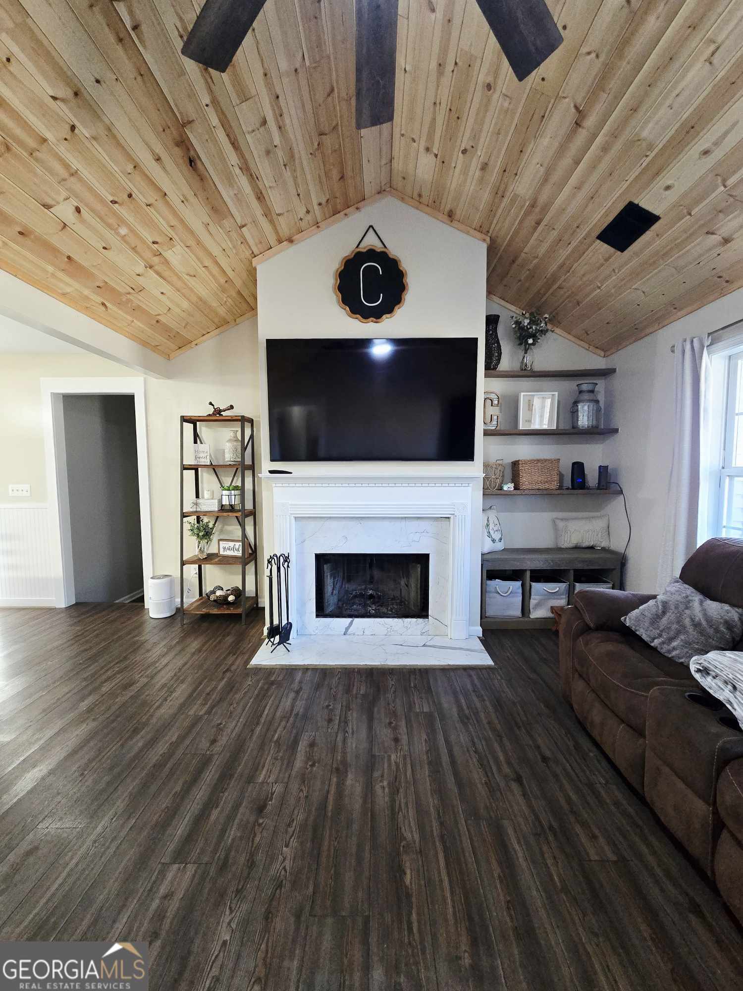 10 Shannons Lane Comer, GA 30629 - Photo 24 of 50 a living room with furniture and a fireplace
