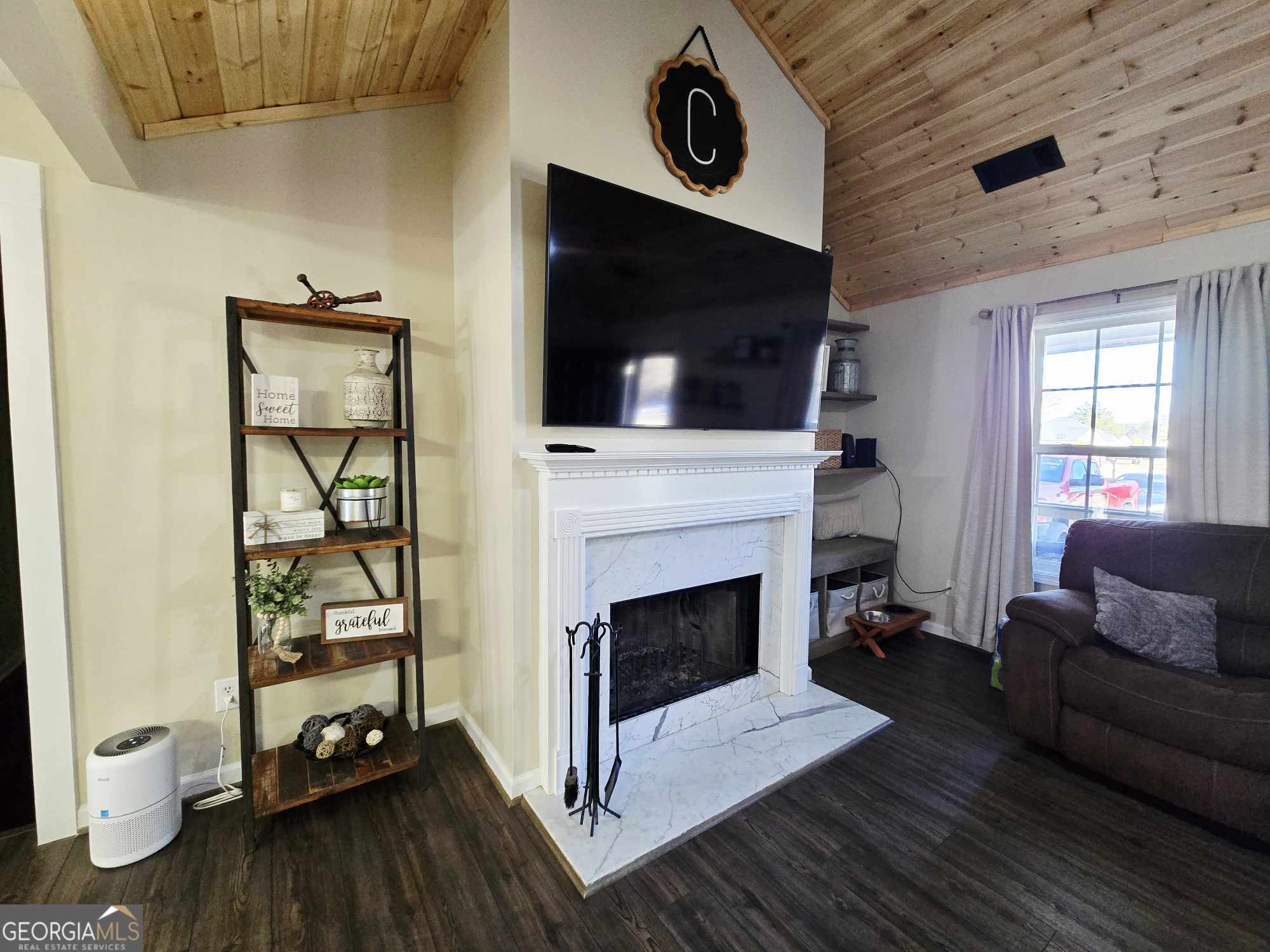 10 Shannons Lane Comer, GA 30629 - Photo 25 of 50 a living room with furniture and a fireplace