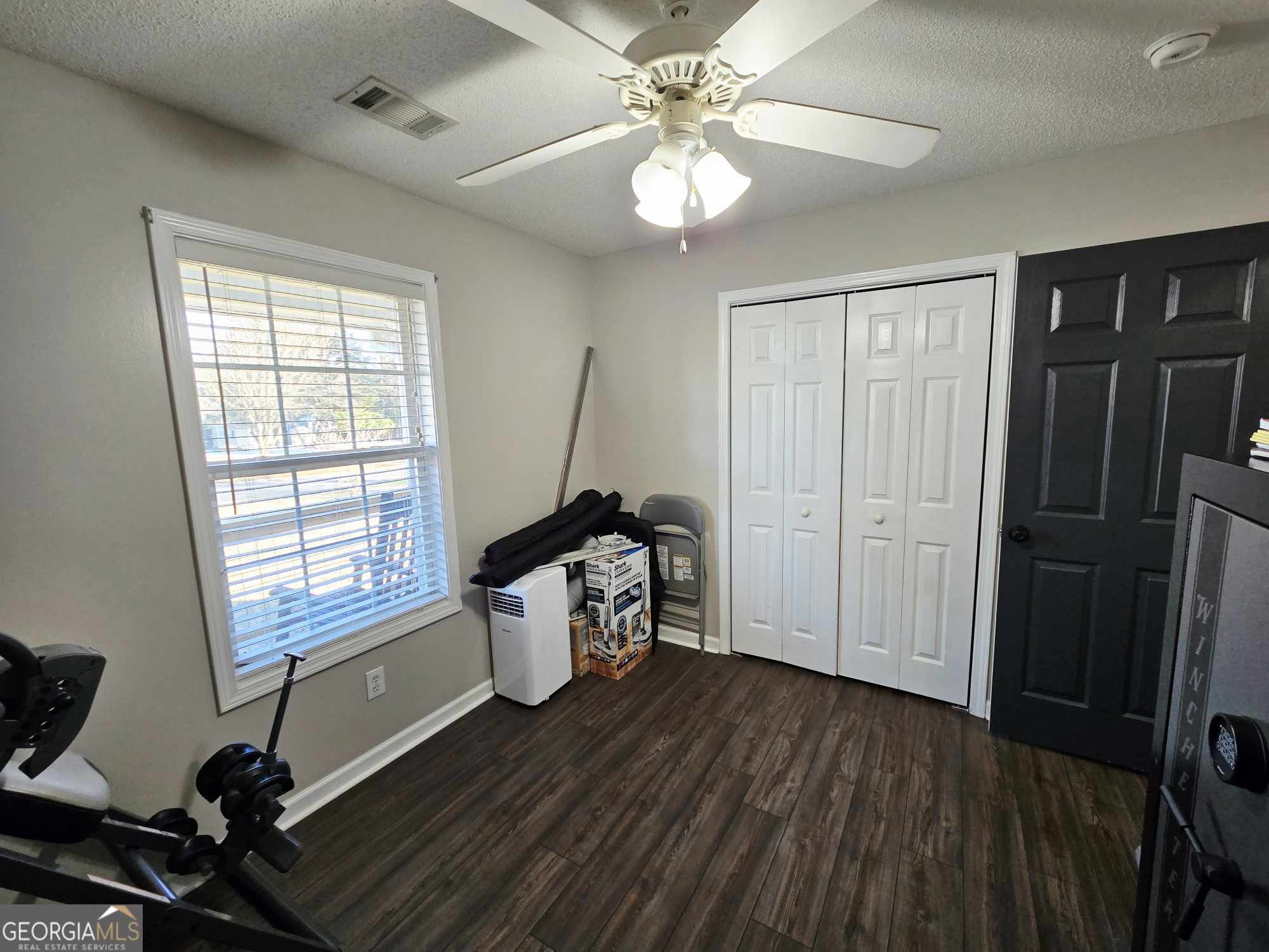 10 Shannons Lane Comer, GA 30629 - Photo 32 of 50 a view of a room with gym equipment and wooden floor