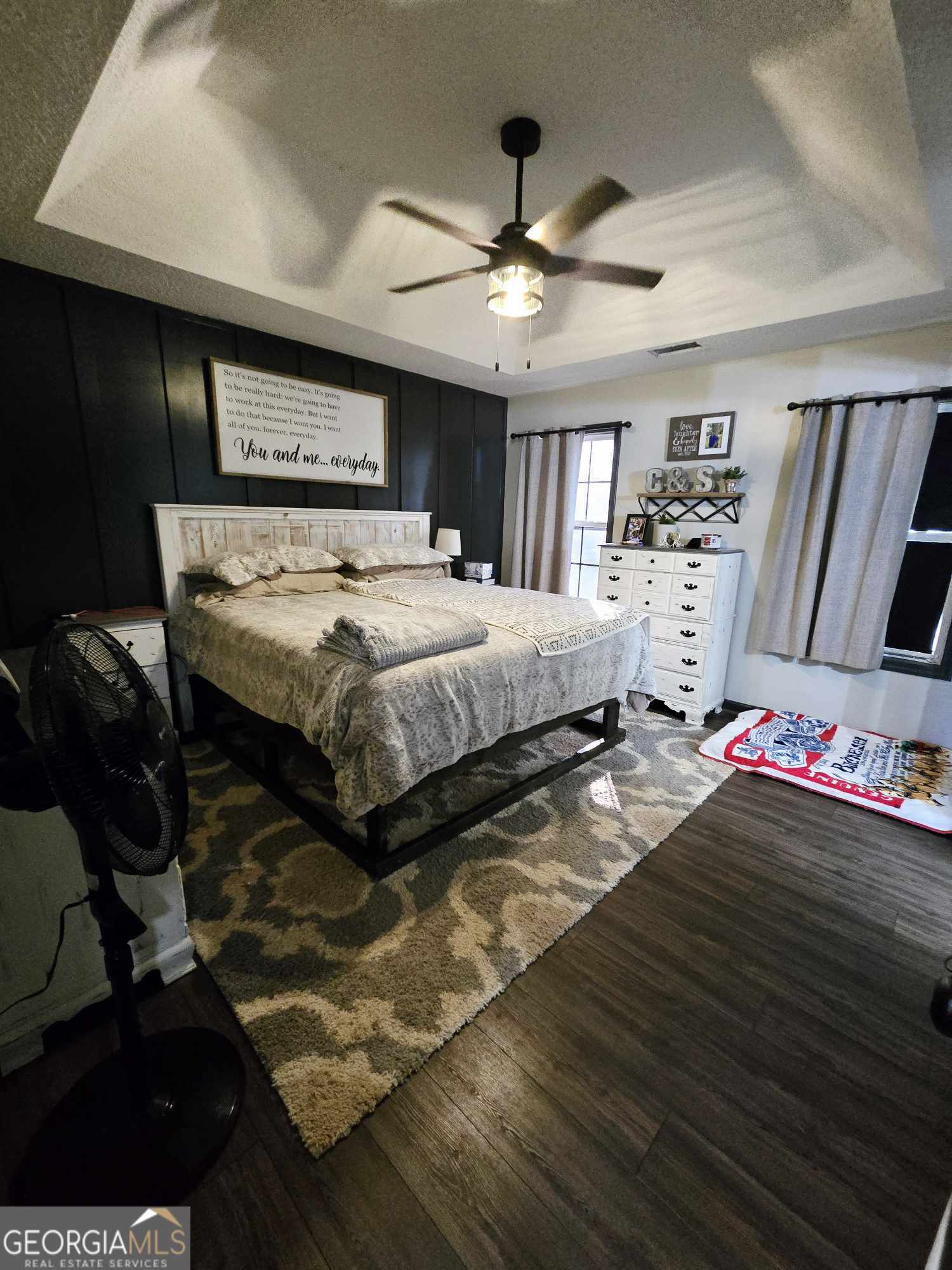 10 Shannons Lane Comer, GA 30629 - Photo 36 of 50 a bedroom with a bed mirror and a ceiling fan