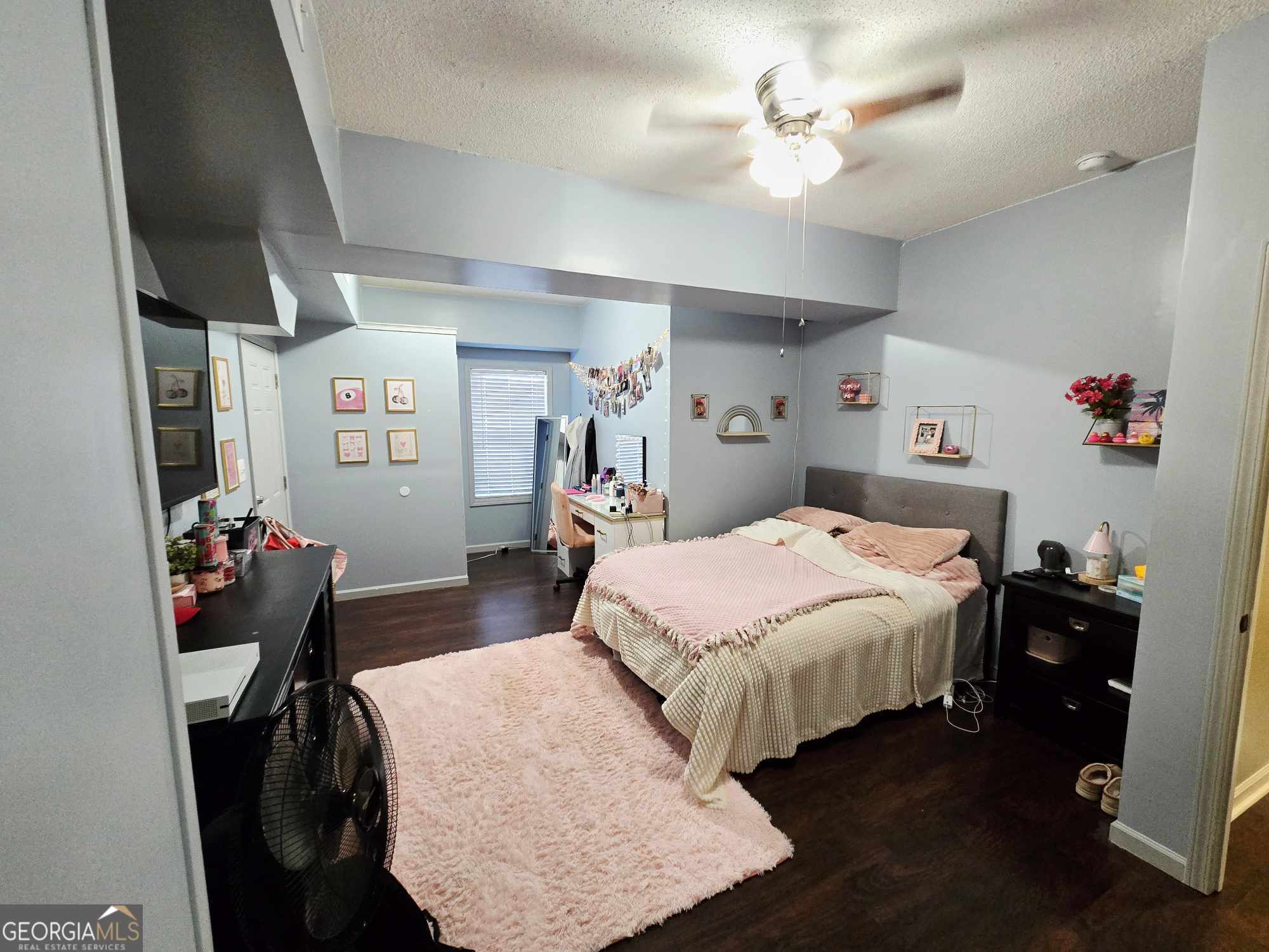 10 Shannons Lane Comer, GA 30629 - Photo 41 of 50 a bedroom with a bed and a chandelier
