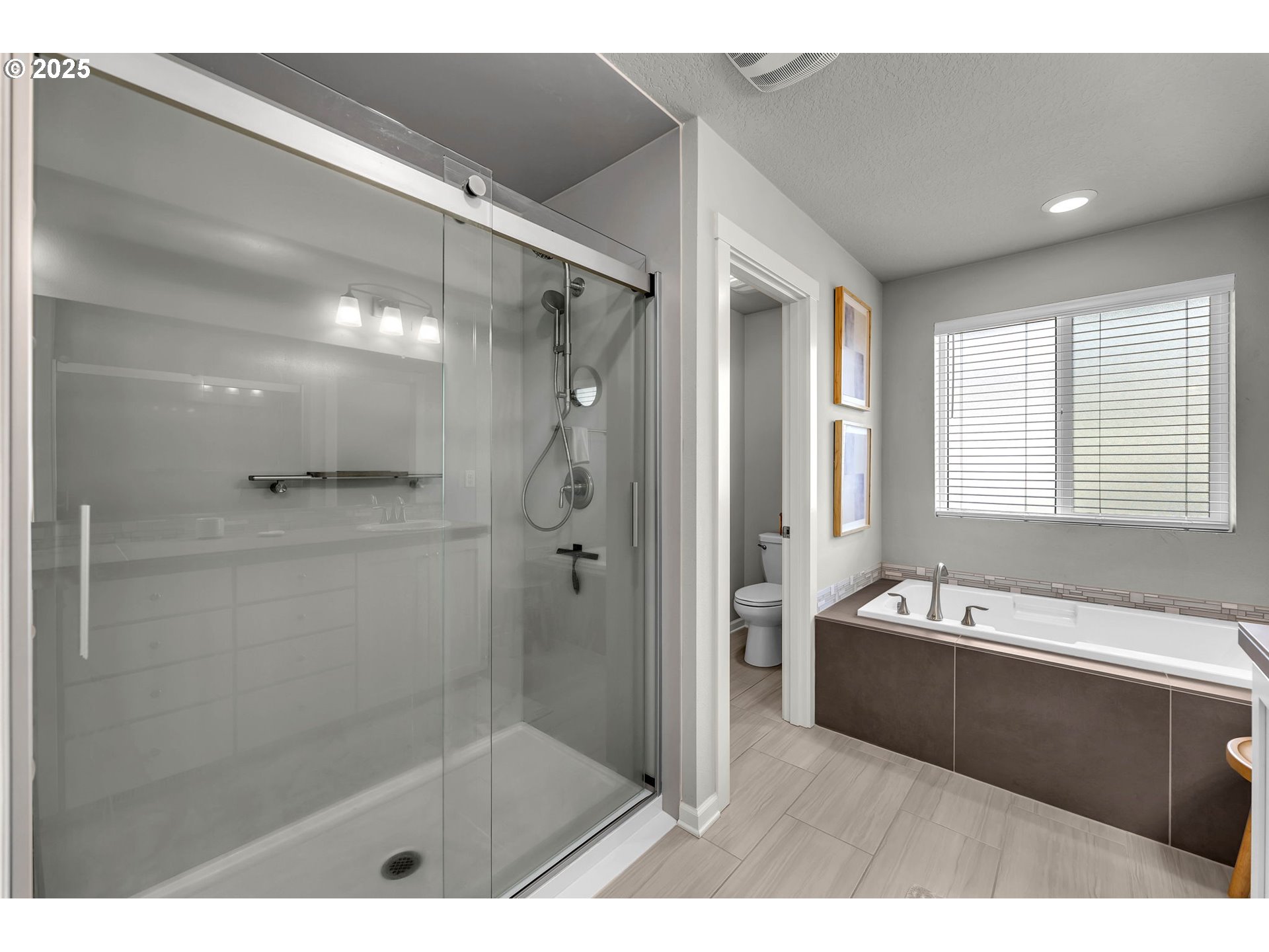 3615 South Star View Loop Ridgefield, WA 98642 - Photo 28 of 46 a bathroom with a tub a sink and a shower