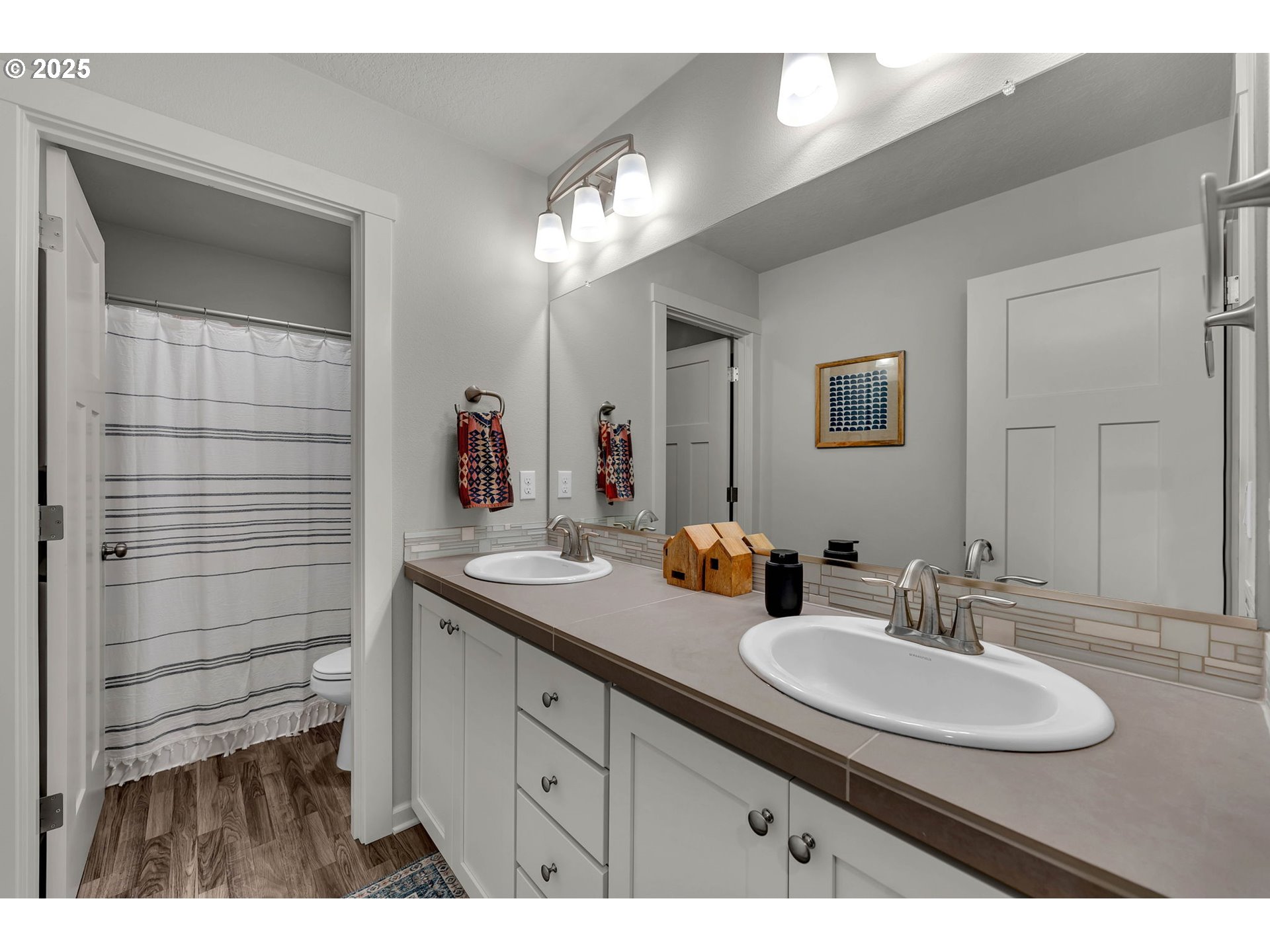 3615 South Star View Loop Ridgefield, WA 98642 - Photo 32 of 46 a bathroom with a sink double vanity and a mirror
