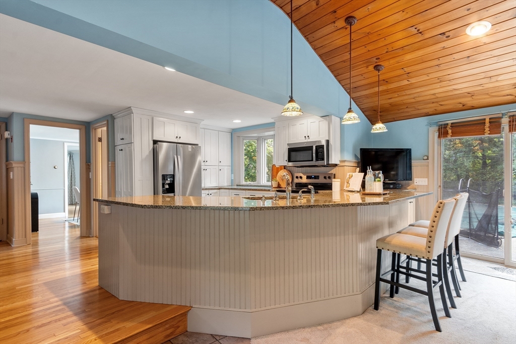 26 Wing Road Lynnfield, MA 01940 - Photo 12 of 39 a view of kitchen with stainless steel appliances refrigerator stove microwave and cabinets