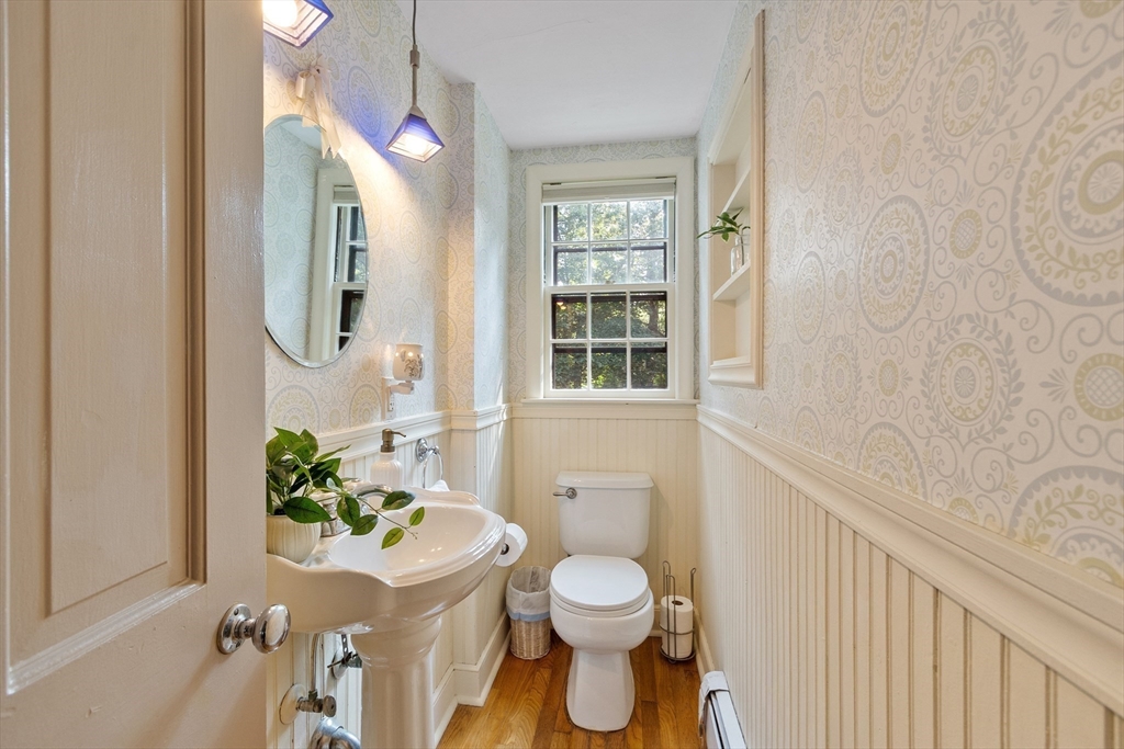 26 Wing Road Lynnfield, MA 01940 - Photo 15 of 39 a bathroom with a sink a toilet and a mirror