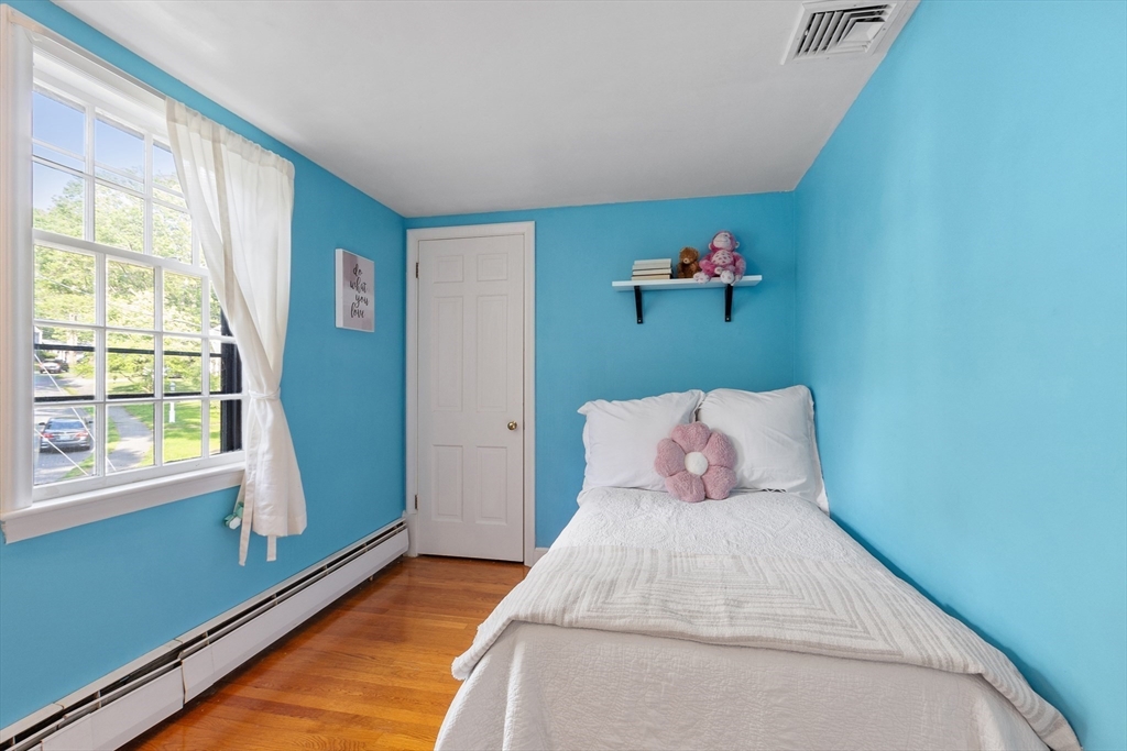 26 Wing Road Lynnfield, MA 01940 - Photo 23 of 39 a bedroom with a bed and window
