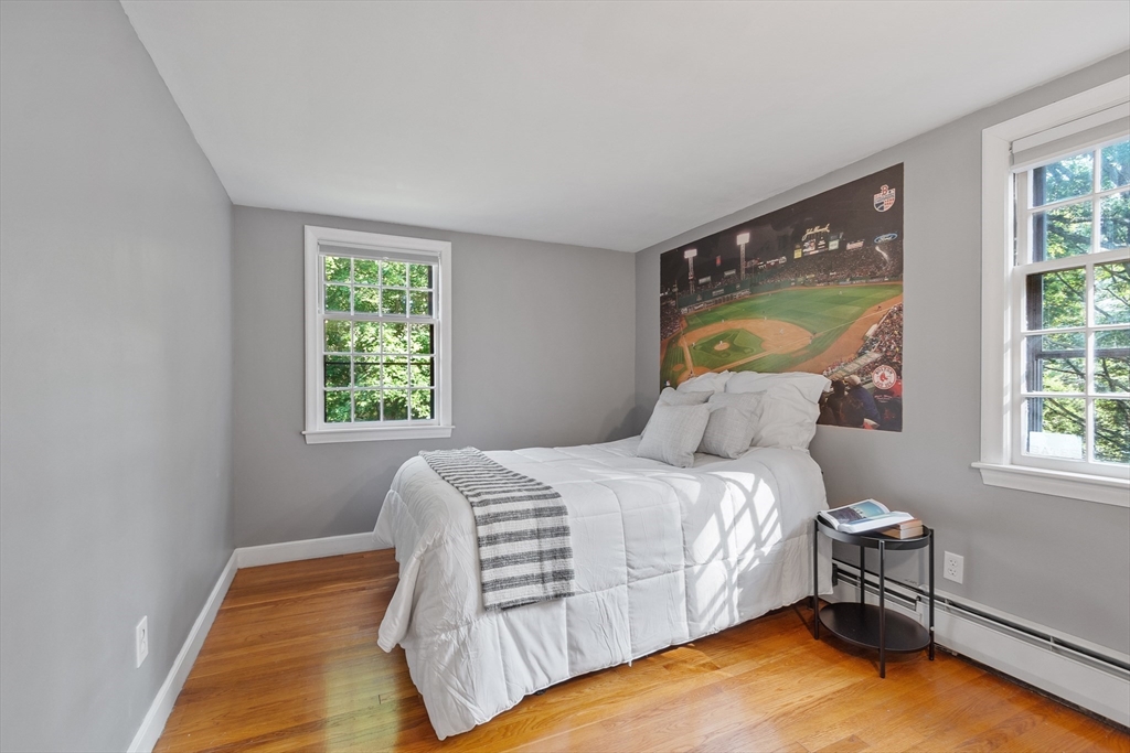 26 Wing Road Lynnfield, MA 01940 - Photo 26 of 39 a bed sitting in a bedroom next to a window