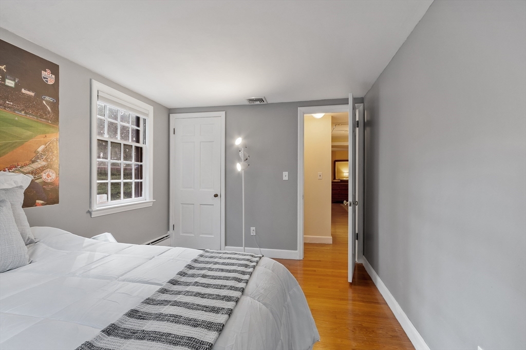 26 Wing Road Lynnfield, MA 01940 - Photo 27 of 39 a bedroom with a bed and a window