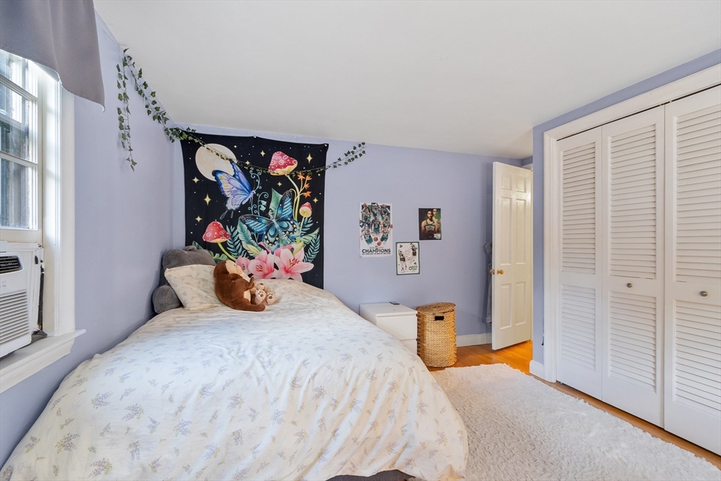 26 Wing Road Lynnfield, MA 01940 - Photo 29 of 39 a bedroom with a bed and a window