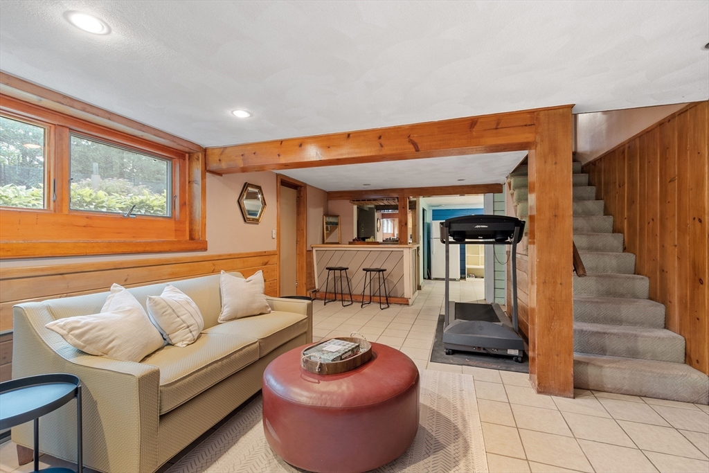 26 Wing Road Lynnfield, MA 01940 - Photo 33 of 39 a living room with furniture and a large window