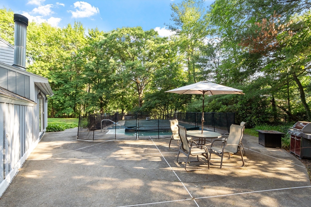 26 Wing Road Lynnfield, MA 01940 - Photo 39 of 39 a view of backyard with outdoor seating and trees
