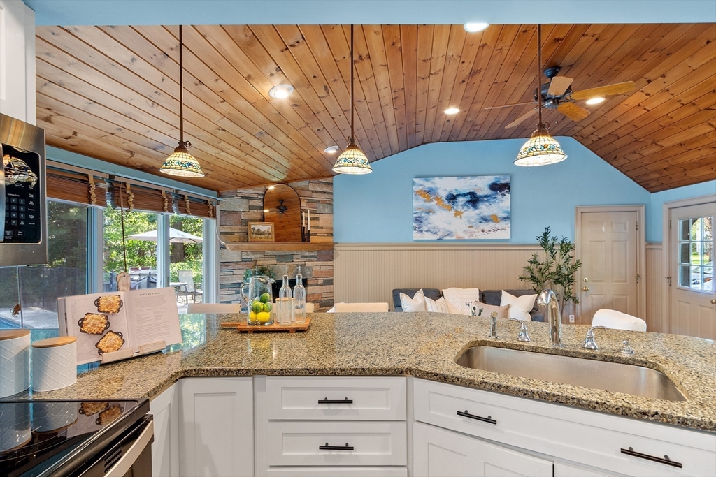 26 Wing Road Lynnfield, MA 01940 - Photo 8 of 39 a kitchen with granite countertop a sink and window