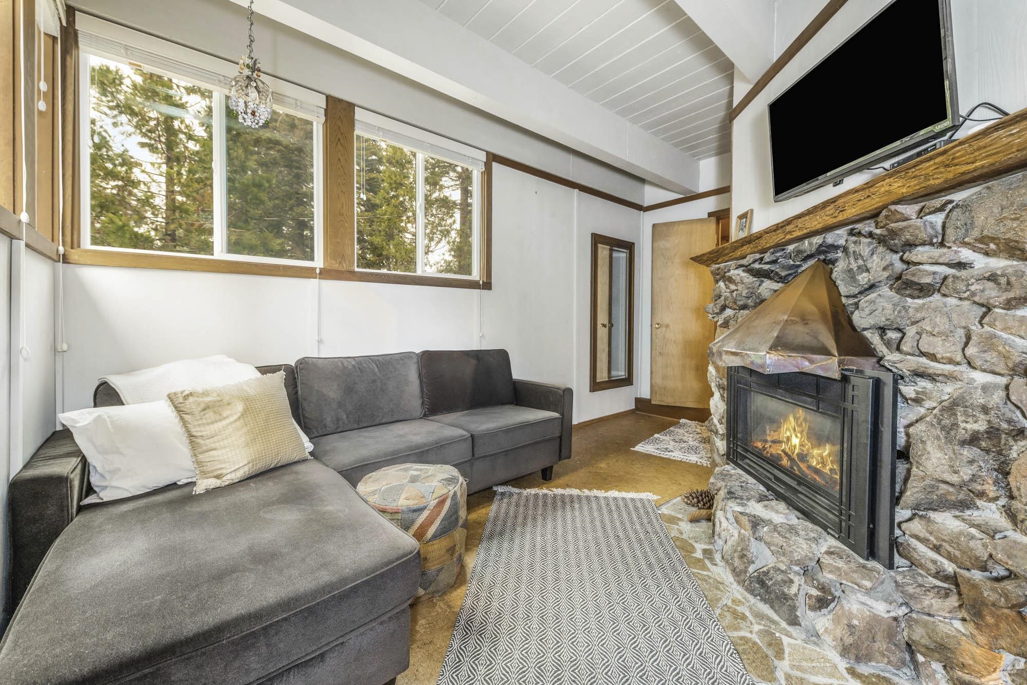 375 Ellis Road Homewood, CA 96141 - Photo 17 of 21 a living room with furniture and a fireplace