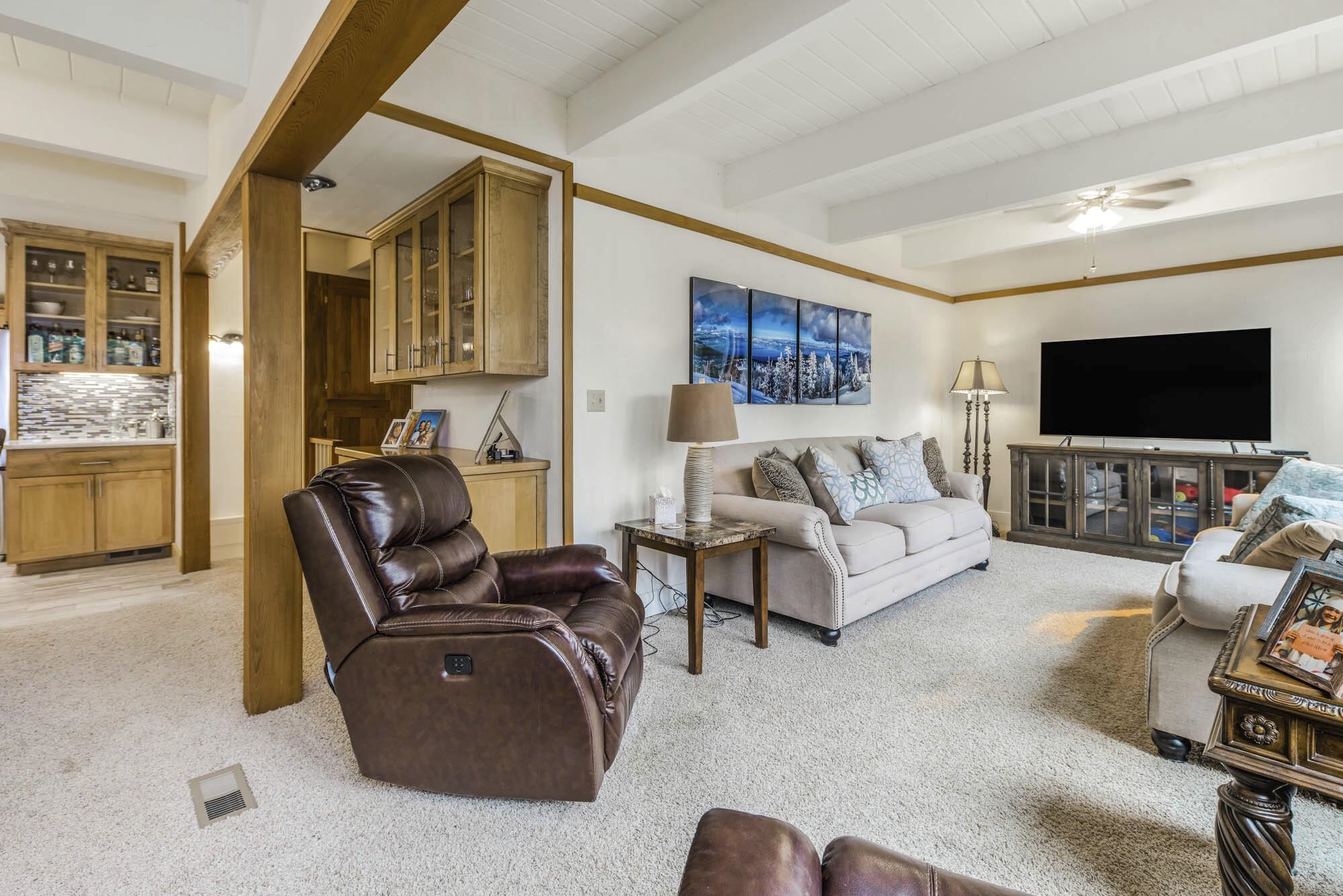375 Ellis Road Homewood, CA 96141 - Photo 9 of 21 a living room with furniture and a flat screen tv