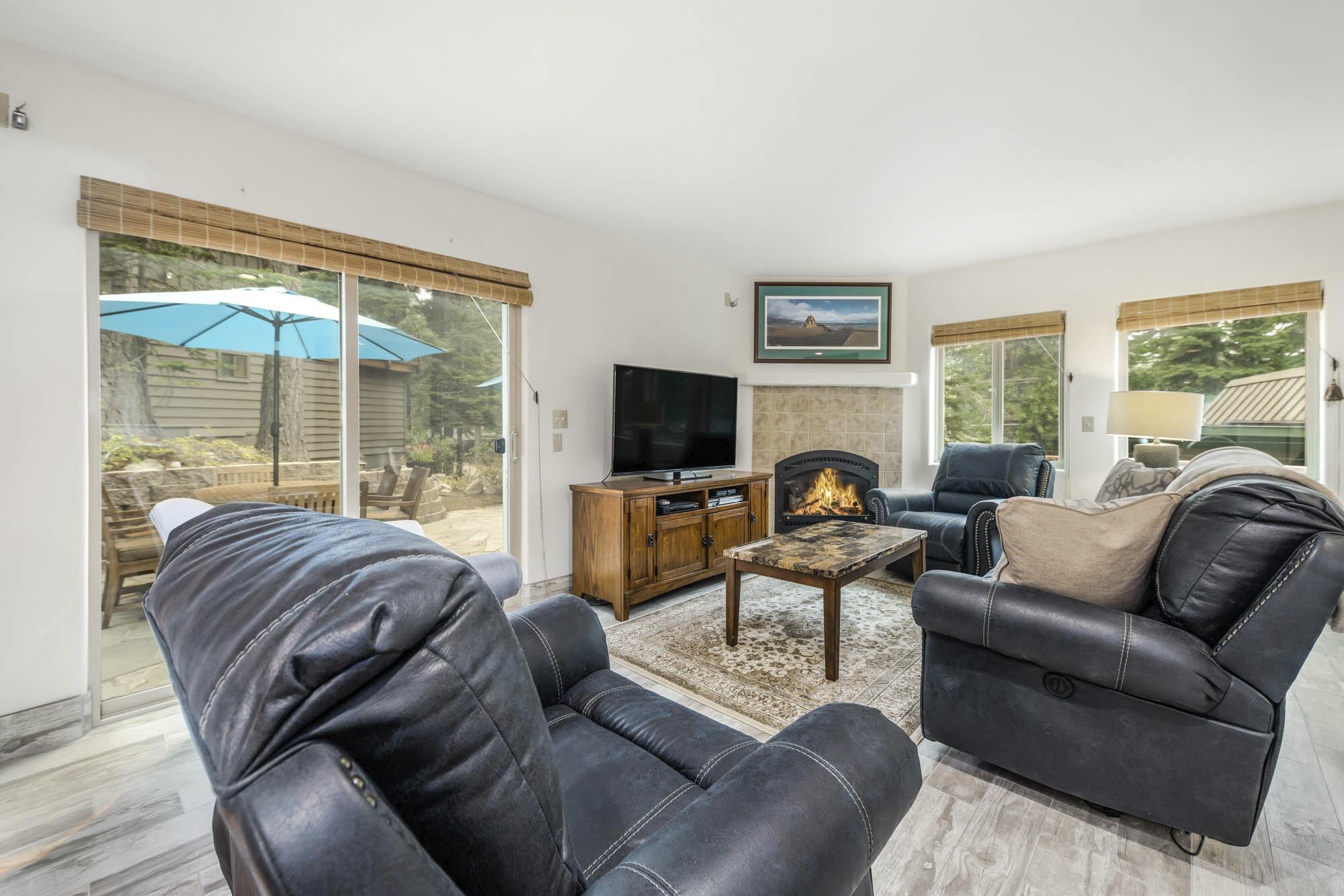 375 Ellis Road Homewood, CA 96141 - Photo 10 of 21 a living room with furniture a large window and a flat screen tv